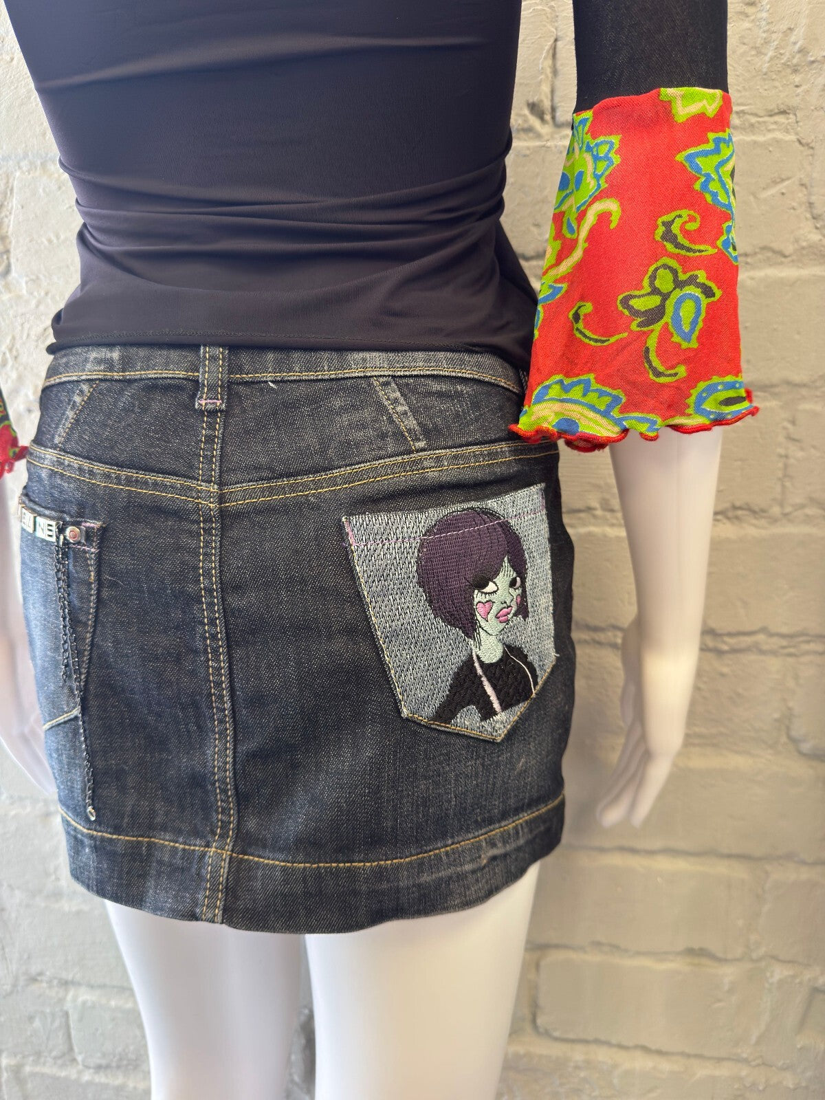 Denim Mini Skirt with Artistic Back Pocket Detail