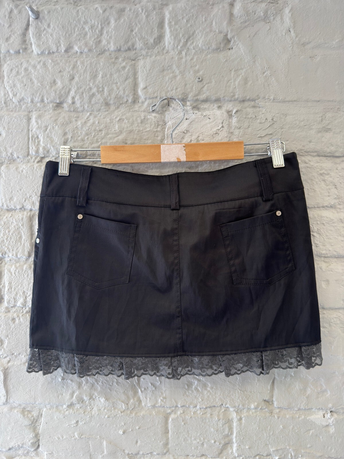 Black Mini Skirt with Lace Trim and Button Detail