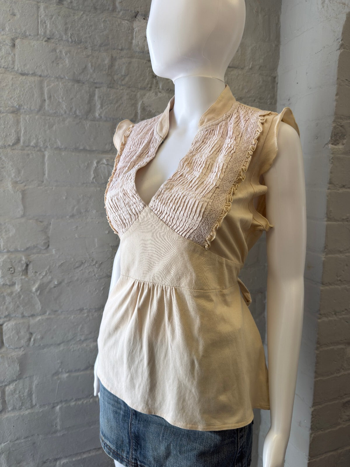 Beige Sleeveless Top with Lace Detail and Tie Back
