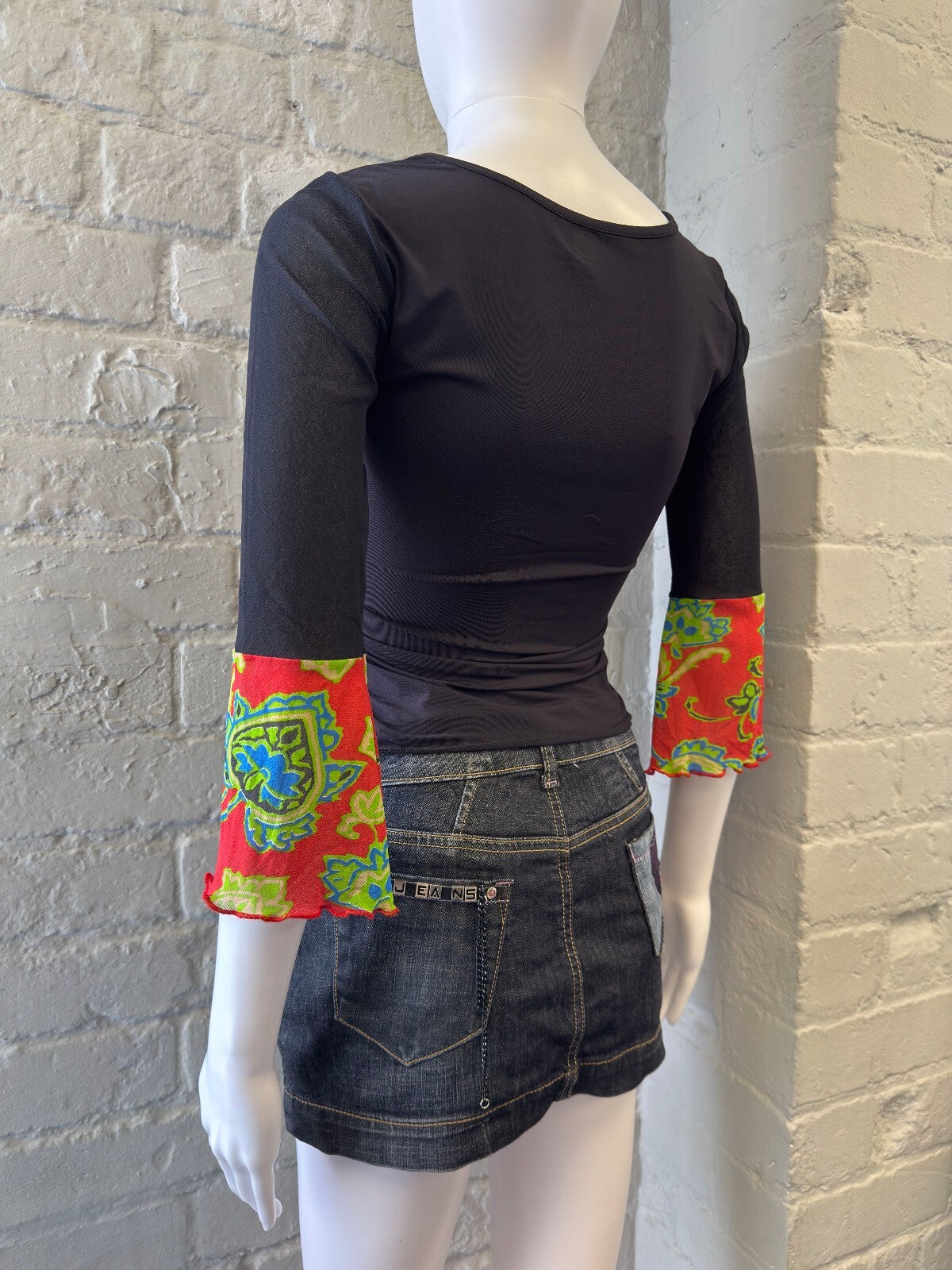 Black Top with Colourful Printed Sleeves and Front Graphic