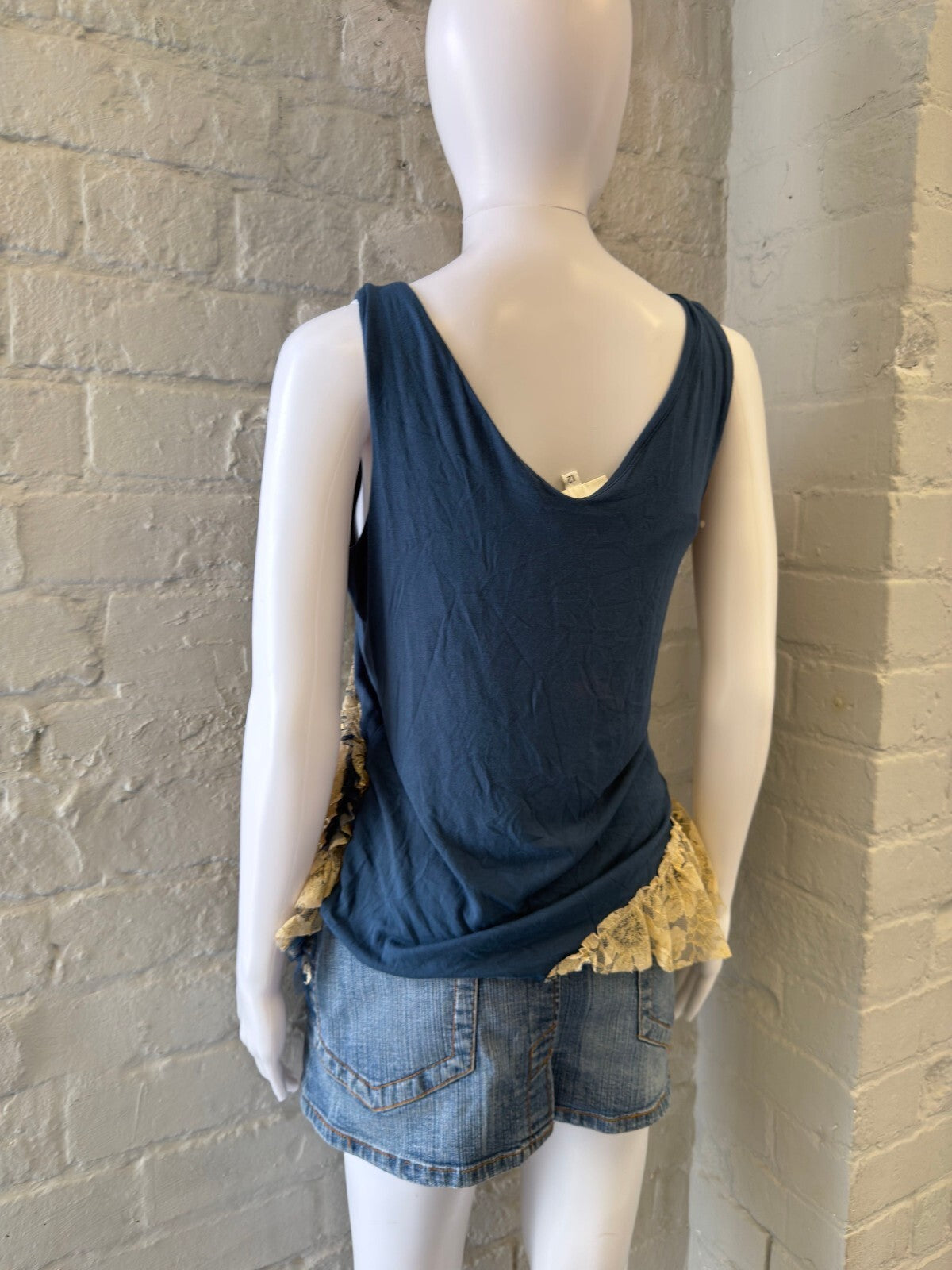 Navy Blue Sleeveless Top with Cream Lace Ruffles